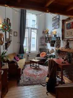 a living room filled with furniture and lots of windows