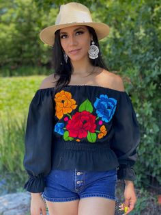 This Beautiful Mexican blouse has a unique Bell Sleeve design, elastic around the waist and embroidered flowers in the front. This blouse comes in one size which fits sizes Small and Medium. Find more colors here: https://www.etsy.com/es/listing/798642680/blusa-mexicana-con-mangas-acampanadas?ref=listing_published_alert Summer Festival Peasant Top With Embroidered Sleeves, Spring Festival Peasant Top With Floral Embroidery, Black Peasant Top With Floral Embroidery For Festivals, Black Floral Embroidered Peasant Top For Festival, Fitted Floral Embroidery Peasant Top, Black Bohemian Peasant Top With Floral Embroidery, Bohemian Embroidered Fitted Top For Festivals, Fitted Peasant Embroidered Top With Floral Details, Fitted Bohemian Peasant Top With Floral Embroidery