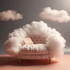 a couch covered in clouds sitting on top of a pink floor next to a gray wall