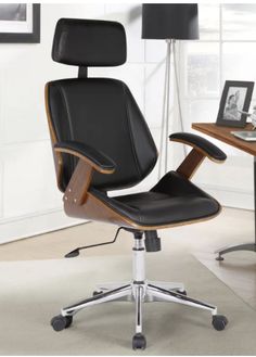 an office chair sitting in front of a computer desk