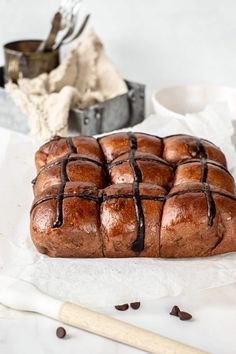 a loaf of chocolate bread sitting on top of parchment paper