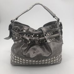 Rebecca Minkoff Devote Tote Hobo Handbag Bucket Bag Metallic Silver Studded Heavy Approximate Measurements: 14" W X 11" T 6.25: Handle Drop Good Pre-Owned Condition. Stain On Lining (See 8th Photo). Some Light Scratches From Wear On Studs. No Rips Or Holes. Please See Photos For Condition Details. From A Smoke-Free, Pet-Friendly Home. Designer Rectangular Hobo Bag With Silver-tone Hardware, Designer Satchel Hobo Bag, Luxury Crossbody Hobo Bag For Errands, Designer Shoulder Bag With Adjustable Strap For Errands, Everyday Tote Bag With Silver-tone Hardware, Designer Hobo Bag With Double Handle For Errands, Designer Double Handle Hobo Bag For Errands, Luxury Bucket Hobo Bag For Errands, Luxury Bucket Shape Hobo Bag For Errands