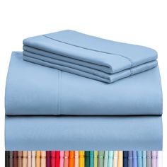 the sheets and pillow cases are lined up in different colors, with one sheet folded on top