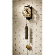 an old fashioned clock hanging on the wall