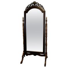 an ornate wooden mirror is shown against a white background