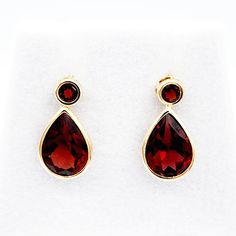 "14kt Yellow Gold Genuine Garnet 4.7cts Weight of earrings: 1.1 gm Size of round stone: 3x3mm Size of tear shaped stone: 8x6mm Size of earrings: Drop length 0.55\", Width 0.30\" Color: Red Made in Canada Comes with 14K gold silicon clutches for cushioned comfort and loss prevention and in a beautiful gift box - Perfect for gifting ------------------------------------------------ * Please click here to visit my shop: https://www.etsy.com/shop/bestjewelryset * To see more earrings please check out Formal Yellow Gold Teardrop Gemstone Earrings, Birthstone Earrings, January Birthstone, Birthstone Earring, Earrings Drop, Beautiful Gift Boxes, Jewelry Earrings Studs, Amazing Jewelry, Jewelry Set