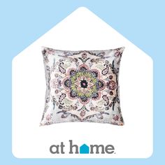 a pillow with an ornate design on the front and back of it that says at home