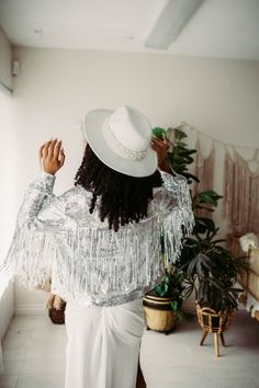 Disco style jacket, shiny, with lots of fun Fringe! Has some stretch. Does not close shut with any fastener. Sizes: S-L and L-XXXLLength: 22 inchesUpper arm: 12 inches around with 4-6 inches of stretch. Bust: S-XL : 39 inchesL-XXXL: 50 inchesUpper arm: 16 inches around with 4-6 inches of stretch. Made by our production partners, not hand-made. In use photo by @popofcolorimagesShown here with the white slip - You can find the slip here: https://www.etsy.com/listing/745150347/boho-lace-dress-vinta Shiny Winter Party Outerwear, Shiny Fitted Fall Outerwear, Shiny Fitted Outerwear For Fall, Spring Party Outerwear With Shiny Details, Shiny Spring Party Outerwear, Spring Party Shiny Outerwear, Metallic Disco Outerwear For Spring, Glamorous Fitted Metallic Outerwear, Disco Jacket