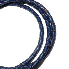 two blue braided leather cords on a white background