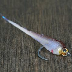 a fishing lure on top of a wooden table