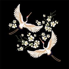 two cranes with flowers on a black background