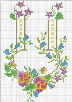 a cross stitch pattern with flowers and two thermometers on each side of it