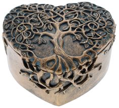 a heart shaped box with intricate designs on it