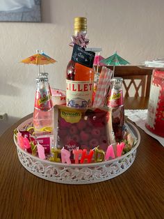 there is a tray with bottles and candy on it