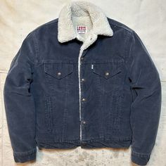 International Shipping Available!  This is a killer Vintage 1980s Levis Sherpa Lined Corduroy Jacket in navy blue! This is in worn in vintage condition as pictured. This is around a mens size S/M and labeled a mens 40. Please refer to all pictures and measurements before buying since all sales are final. All measurements taken while laying flat.  22.5 inches from armpit to armpit. 24 inches from lower collar seam in back of neck to bottom of jacket. 19 inch shoulders. 24 inch sleeves. Since all Jackets Aesthetic, Blue Collar Men, Levis Sherpa, Masculine Style, Levis Jacket, Winter Outfits Men, Flannel Jacket, Sherpa Jacket, Corduroy Jacket