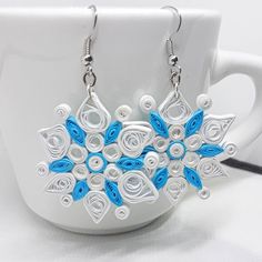 These festive snowflake dangle earrings are just in time for your winter celebrations, whether to liven up your own holiday ensemble or as a fun gift for friends or family! Made from 100% recycled paper and glazed with a protective matte finish, these unique paper quilled earrings are lightweight and comfortable to wear. This product is Handmade to Order and no two sets will be exactly the same. If you have any custom requests, just add a message when placing the order and I will be happy to obl Diy Quilling Earrings, Knight Owl, Snowflake Paper, Handmade Paper Art, Paper Quilling Earrings, Paper Bead Bracelet, Quilled Earrings, Purple Drop Earrings, Paper Quilling Jewelry