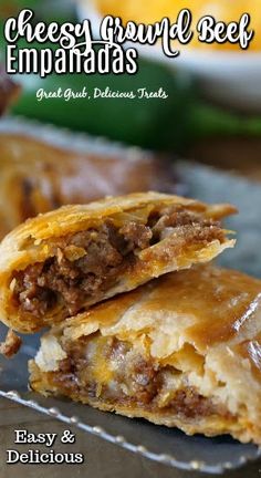 Closeup shot of two halves of delicious ground beef empanadas on plate. Empanadas Recipe Beef And Cheese, Beef And Cheese Empanadas Recipe, Beef And Cheese Empanadas, Ground Beef Empanadas, Easy Empanadas Recipe, Handheld Food, Beef Empanadas Recipe, Cheesy Ground Beef, Empanada Recipe