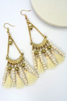 Ready for the club, the tropics, or even the beach/pool parties. We will not let you down with these cute bohemian fun earrings. Size+Fitlength: 4"Width: 1" Bohemian Jewelry For Summer Beach Party, Bohemian Dangle Earrings For Beach, Gold Fringe Earrings For Beach, White Fringe Earrings For Summer, Gold Tassel Earrings For Beach, Gold Dangle Tassel Earrings For The Beach, Beach Gold Fringe Earrings, Bohemian Dangle Jewelry For Beach Season, Beach Gold Tassel Earrings