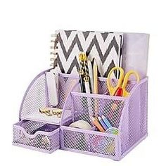 a purple desk organizer with pens, pencils and scissors