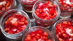 several jars filled with sliced up red peppers