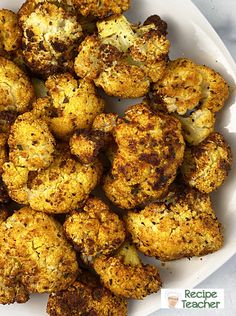 cooked cauliflower in a white bowl on a table