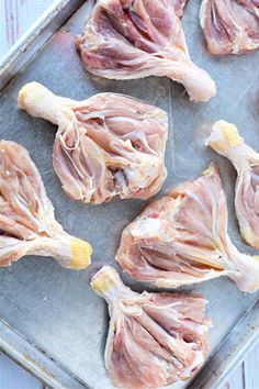 raw chicken on a baking sheet ready to be cooked