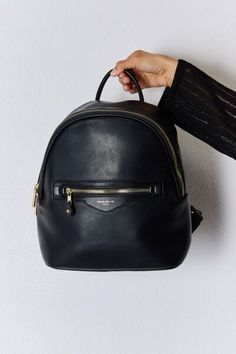 *This is a drop ship item, which means it will ship from another facility. If you order multiple items, your order could come in separate packages. Estimated ship time is 5-10 business days.* This PU leather backpack is a versatile and fashionable accessory for any occasion. Made with high-quality PU leather, it offers durability and a sleek look. The spacious interior and multiple compartments provide ample storage for all your essentials. Whether you're commuting to work or exploring a new cit Vegan Leather Backpack, Faux Leather Backpack, Travel Size Beauty Products, Blue Zones, Athleisure Tops, Commute To Work, Black Leather Backpack, Sleek Look, Mens Fragrance