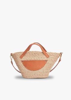 Sturdy straw and vegetable tanned leather come together to make the perfect warm weather tote. This compact version will take you from poolside to the city in a snap. Handcrafted from all-natural straw. Features hidden magnetic snap with an optional crossbody strap. Measures 13” W x 6.5” H x 4” D with a 2” handle drop. Summer Woven Leather Top Handle Bag, Woven Leather Top Handle Beach Bag, Luxury Rectangular Bucket Bag For Market, Chic Natural Beach Bag With Woven Leather, Beach Bag With Leather Handles And Natural Fiber, Summer Beach Bag With Leather Handles And Top Handle, Summer Jute Shoulder Bag With Top Handle, Beach Bag With Top Handle And Leather Handles, Vacation Woven Leather Crossbody Bucket Bag