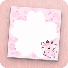 a pink card with an image of a little pig on it's face and flowers in the background