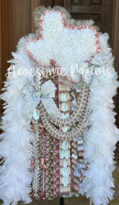 an elaborately decorated mannequin with feathers and jewels