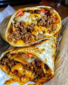 two burritos are stacked on top of each other