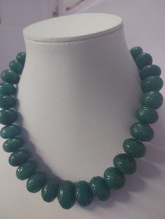 15'' Emerald Beryl AA+ 961 Carat Fine Quality Emerald Pumpkin 18-22mm Beads Gemstone adjustable cord Necklace Stone : emerald beryl Shape :- fancy Pumpkin Necklace - 15 inch 1 line string Size :- 18mm to 22mm Weight :- 961 carat Polish :- Handmade color - green makes a great gift for your loved ones. It is known as the 'love stone' as the message it emits is the strong vibration of unconditional love, joy, warmth and healing. As quartz crystals are profound amplifiers of energy, it may help to k Adjustable Jade Necklace With Large Beads, Adjustable Carved Round Necklace, Adjustable Round Carved Necklaces, Adjustable Carved Round Necklaces, Carved Jade Round Bead Necklaces, Carved Jade Round Bead Necklace, Carved Jade Bead Necklaces, Adjustable Green Carved Necklace, Adjustable Green Carved Necklaces