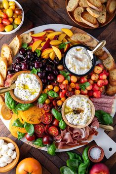 a platter filled with different types of appetizers and breads on top of a wooden table