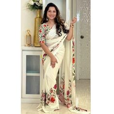 Off White colored saree is made from georgette fabric which is highlighted with beautiful floral digital printed work as shown. comes along with unstitched digital printed georgette blouse which you can customise as per your design/style. Occasion - You can wear this saree for festive and functions, outing and get-together. Note:- the actual product may differ slightly in color and design from the one illustrated in the images when compared with computer or mobile screen. Measurements: Saree : G Traditional White Pre-draped Saree With Floral Print, Festive Georgette Saree With Printed Details, Festive Georgette Printed Saree, Printed Georgette Saree For Festive Occasions, Fitted Georgette Pre-draped Saree With Digital Print, Printed Georgette Saree For Festivals, Printed Georgette Blouse Piece For Saree, Festival Georgette Saree With Print, Traditional Printed Georgette Saree