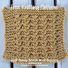 a knitted square sitting on top of a white wooden floor with text overlay that reads, free knitting pattern half daisy stitch knit kit square