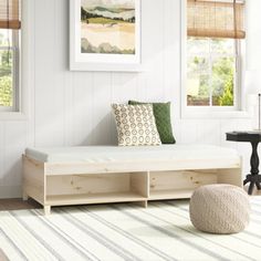 a living room with white walls and wooden furniture