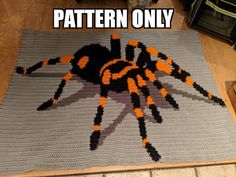 a crocheted rug with an orange and black spider on it that says, pattern only