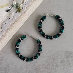 These sculptural thick beadwork hoops in discreet green, silver and black color combination look like grinning snake skin. If you love bohemian or ethnic style jewelry, but at the same time prefer sober shades, thay may be your choice. These big statement circle earrings, a perfect specimen of boho jewelry, are beaded of high quality seed beads, are light and comfortable to wear, so you can use them as your everyday casual accessories with no discomfort. ♥ SIZE Approximately 2.2"  ♥ 100% handmade ♥ Packed in a gift box ♥ Very light ♥ If you want this item in a different color, send me a message, please. Feel free to communicate with me. You can see more hoop earrings here: https://etsy.me/2ANdatu Advice on use and care: * Do not wear while bathing or showering. Chlorine can cause damage. * Big Circle Earrings, Hoop Earrings Big, Black Color Combination, Green Snake, Earrings Big, Snake Earrings, Casual Accessories, Beaded Hoop Earrings, Beaded Hoops