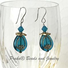 Awesome Czech glass earrings, made with sterling silver and brass. Bright blue (Caribbean blue) Czech glass beads are a teardrop shape. Gold etching on both sides of the bead. Bead size 17MM x 12MM. Blue And Gold Earrings, Murano Glass Earrings, Lotus Earrings, Mixed Metal Earrings, Blue Lotus, Caribbean Blue, Bead Store, Metal Earrings