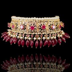 Radiating the elegance of our culture, this heritage piece speaks of sophistication and excellence! Exuding old world charm, this set is strung together with beautiful ruby/emerald stones and complementing pearl moti. The set includes a pair of matching earrings. Approximate earrings length is 2.5". Gold-plated on high-quality brass as the base metal. Mahira Set - Emerald is in-stock & ready-to-ship. Delivery time frame for the Mahira Set - Ruby is 4-6 weeks. For custom or urgent requests, pleas Ruby Emerald, Emerald Stone, Old World Charm, Base Metal, Matching Earrings, 2 Colours, Old World, Ruby, Emerald