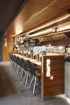 an empty restaurant with chairs and counters