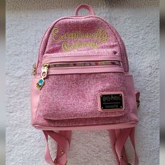 Like New Condition Rare Retired Design Loungefly Harry Potter Luna Lovegood Mini Backpack Embroidered In Gold Thread "Exceptionally Ordinary" Pink Tween Fabric Pink Faux Leather And Rainbow Colored Zippers Inside Is Lined With Colorful Luna Symbols On A Black Background. Front Zippered Pocket And 2 Open Side Pockets Padded Straps Are Adjustable Top Handle Excellent Condition Harry Potter Luna, Harry Potter Luna Lovegood, Loungefly Bag, Luna Lovegood, Gold Thread, Gold Threads, Mini Backpack, Black Background, Black Backgrounds