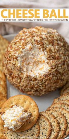 cheese ball on a plate with crackers and crackers