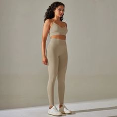 The ultimate fusion of style, comfort, and performance in activewear. This meticulously designed ensemble has been crafted to elevate your fitness routine to new heights while keeping you fashion-forward. The modern, sleek design of this set is both stylish and functional. With a flattering high-waisted legging and a coordinating, form-fitting sports bra, it's the perfect choice for both indoor and outdoor activities.✔️Seamless ✔️Flattering seams to the waistband✔️Compressive waistband ✔️New supportive stretchy fabric ✔️High-stretch fabric✔️Glute contour shading Active Sets, Form Fitting Tops, Stylish Leggings, White Sports Bra, Matching Leggings, Workout Wardrobe, Gym Gear, Gym Style, Yoga Set