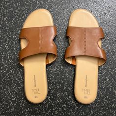 New, Never Been Used Time And Tru Sandals. Casual Tan Flat Flip Flops, Casual Tan Flip Flops For Spring, Casual Tan Synthetic Sandals, Flat Tan Sandals For Spring, Tan Flat Sandals For Spring, Tan Open Toe Sandals With Cushioned Footbed, Tan Synthetic Open Toe Sandals, Tan Slip-on Sandals For Spring, Casual Tan Flat Heel Sandals