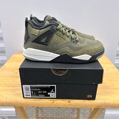 This Limited Edition Air Jordan 4 Craft Sneaker Is Perfect For Young Athletes And Fashion Enthusiasts Alike. The Shoe Features A Comfortable Cushioned Sole And A Suede Upper With Colorblock Accents In Green, Making It A Trendy Addition To Any Outfit. The Lace-Up Closure Ensures A Secure Fit, While The Jordan Logo Adds A Touch Of Style. This Sneaker Is Suitable For All Seasons And Occasions. The Pre-School Size 1y Is Perfect For Young Kids. Get Your Hands On This Trendy Jordan 4 Sneaker Today! 10 Jordan 4 Craft, Jordan 3s, Nike Air Jordan 4 Retro, Nike Air Jordan 4, Jordan Logo, Young Athletes, Air Jordan 4, Air Jordan 4 Retro, Kids Jordans