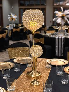 a table set up with gold sequins and place settings for an elegant event