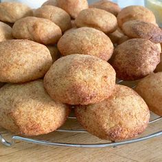 a pile of muffins sitting on top of a glass plate