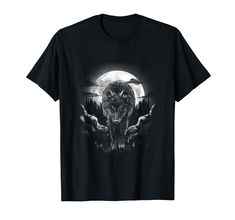 a black shirt with an image of a wolf on it's chest and the moon in