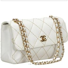 Product Information Look Glamorous And Alluring At Those Day Parties And Events With A Classic And Timeless Style With This Chanel Flap Bag. Featuring A Wild Stitched Quilting On The White Leather, This Bag Is Made Special With Gold Tone Hardware Accents And The Front Cc Twist Lock Closure Along With The Chain Linked Top Handles. Gender Women Includes Dust Bag, Box, Authenticity Card Length 26 Cm Width 6 Cm Height 18 Cm Shoulder Strap 22 Cm Exterior Material Leather X Calf White Crossbody Evening Bag For Shopping, Luxury White Evening Bag, Luxury White Flap Bag With Removable Pouch, White Satchel Evening Bag, White Clutch Bag For Formal Occasions, White Luxury Flap Bag With Gold-tone Hardware, High-end White Shoulder Bag, Designer White Shoulder Bag With Detachable Strap, White Clutch Flap Bag With Dust Bag